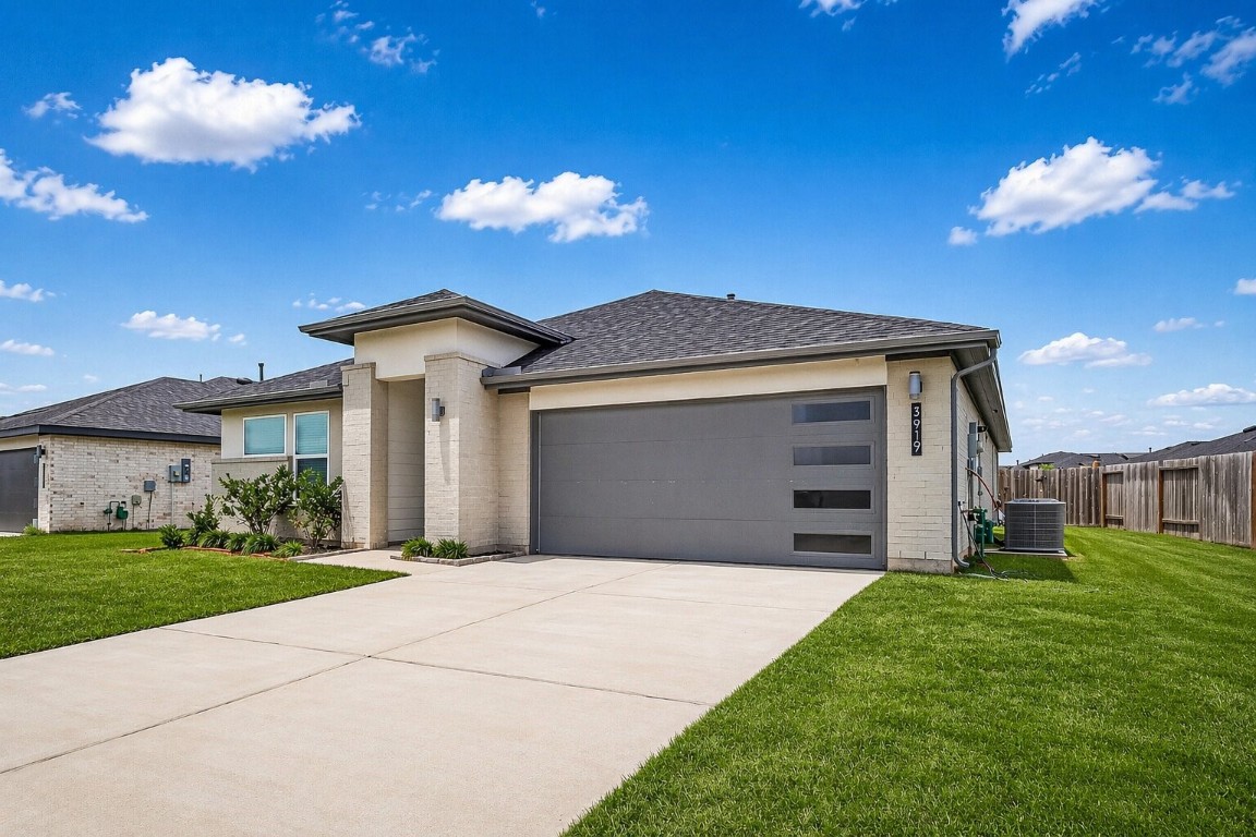 3919 Sparkman Lane Katy, TX 77494 - Photo 3 of 38 Please note: The lawn in this image has been digitally enhanced to appear green and lush. The color has been adjusted for visual representation.