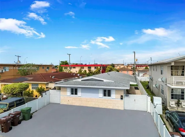 a view of a house with roof deck front of house