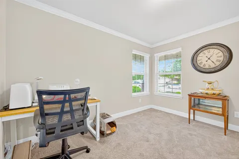 a view of a room with furniture and a window