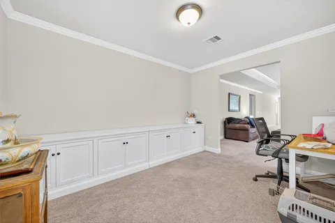 a room with furniture and air conditioner vent