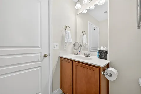 a bathroom with a sink a mirror and shower
