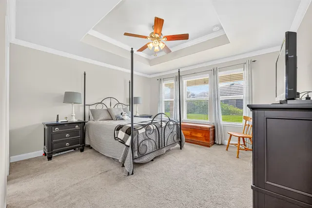 a bed room with a bed and a chandelier