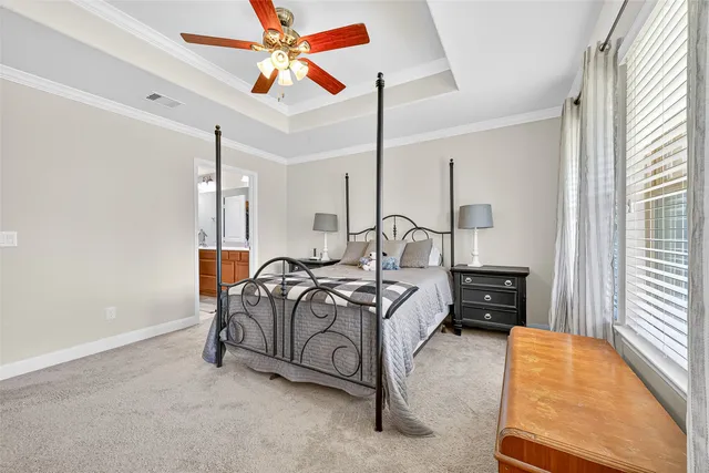 a bedroom with furniture and a window