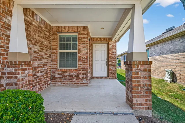 a view of front door of house with outdoor space