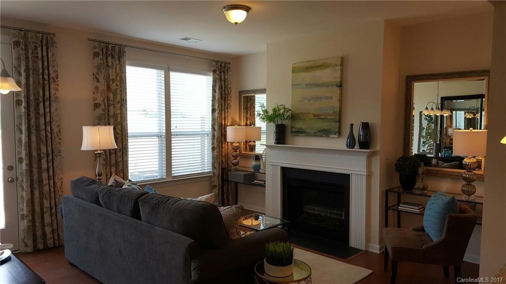 1128 Roderick Drive, Unit 70 FALKNER B Fort Mill, SC 29708 - Photo 18 of 20 a living room with furniture and a fireplace