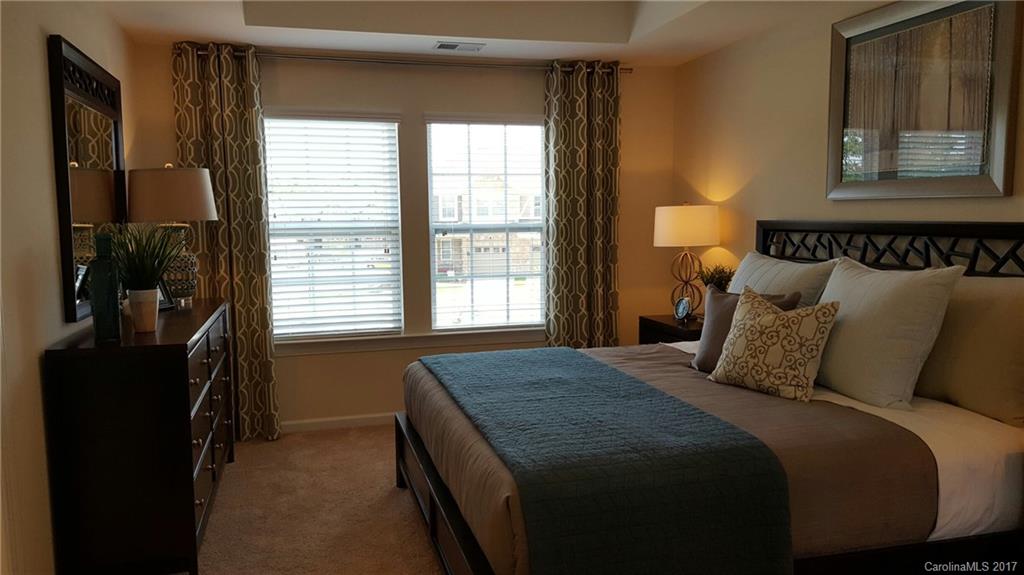 1128 Roderick Drive, Unit 70 FALKNER B Fort Mill, SC 29708 - Photo 19 of 20 a bedroom with a bed and two windows