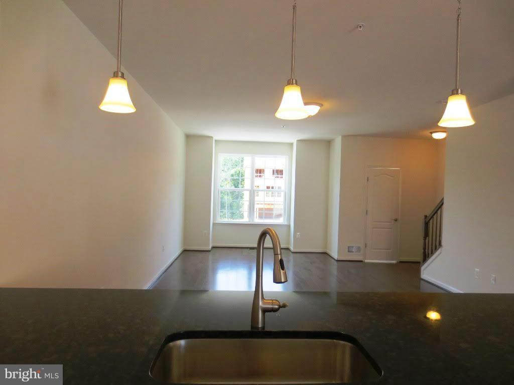 943 Ramble Run Road Baltimore, MD 21220 - Photo 9 of 26 Kitchen Leading to Open Living Room