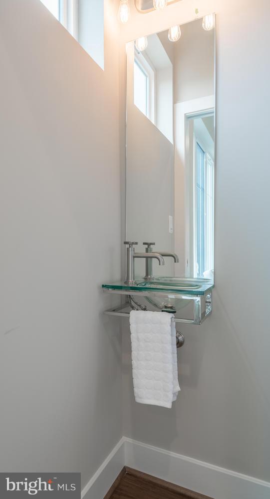 1007 Girard Street Northwest, Unit B Washington, DC 20001 - Photo 11 of 30 a bathroom with a sink and a mirror
