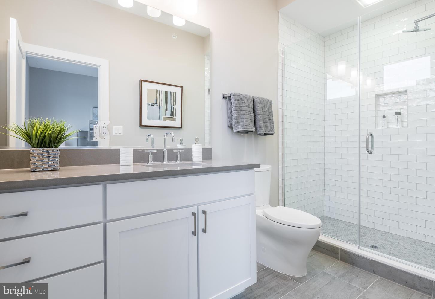 1007 Girard Street Northwest, Unit B Washington, DC 20001 - Photo 15 of 30 a bathroom with a sink a toilet and shower