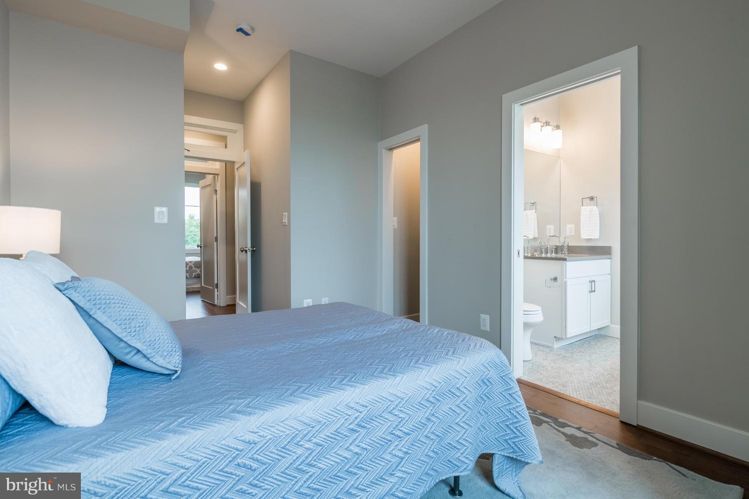 1007 Girard Street Northwest, Unit B Washington, DC 20001 - Photo 17 of 30 a bedroom with a bed and glass door