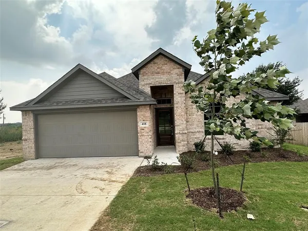 a house with garden in front of it