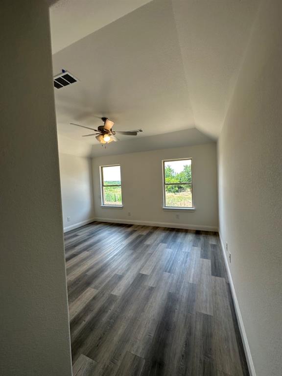 418 South 2nd Street Krum, TX 76249 - Photo 12 of 17 wooden floor in an empty room with a window