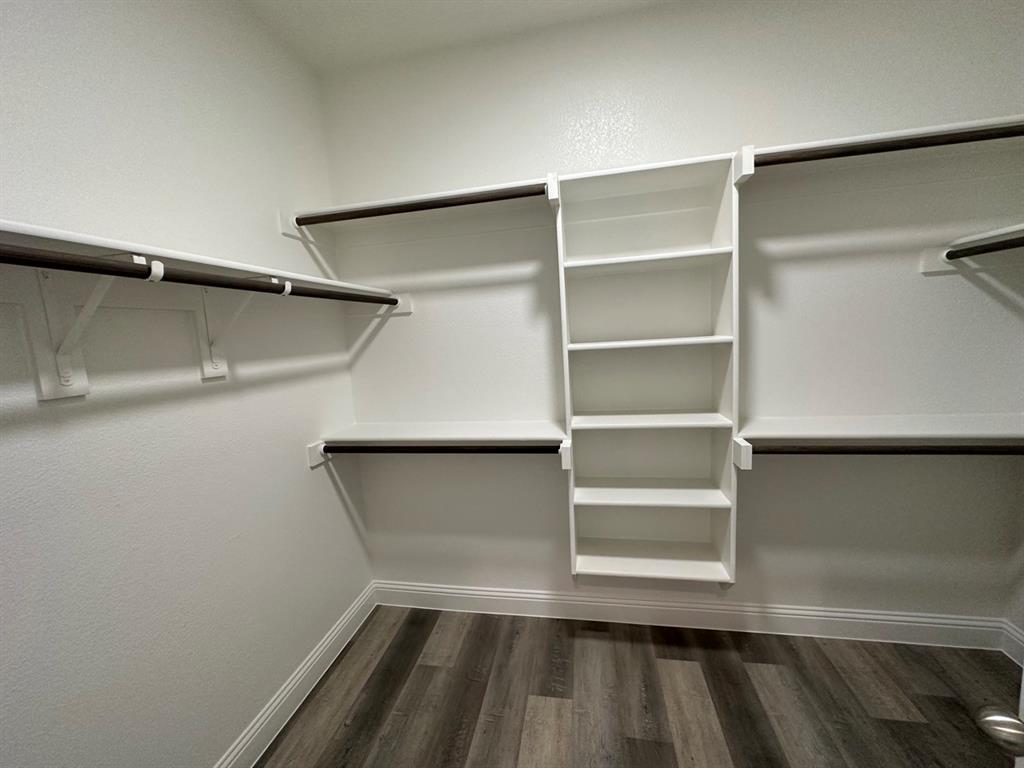 418 South 2nd Street Krum, TX 76249 - Photo 16 of 17 a view of walk in closet with empty racks