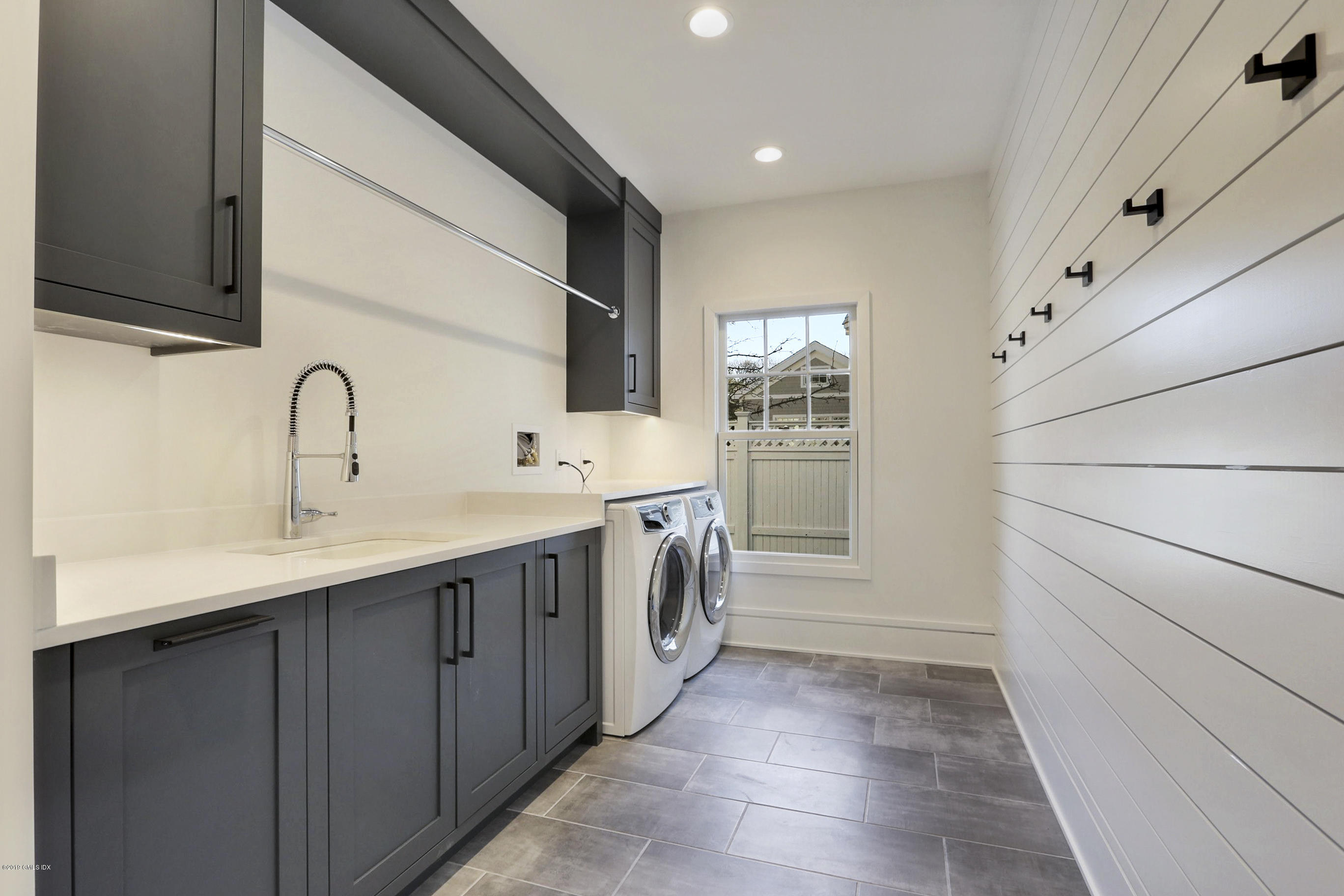 84 Circle Drive Greenwich, CT 06830 - Photo 11 of 25 a kitchen with a sink and cabinets