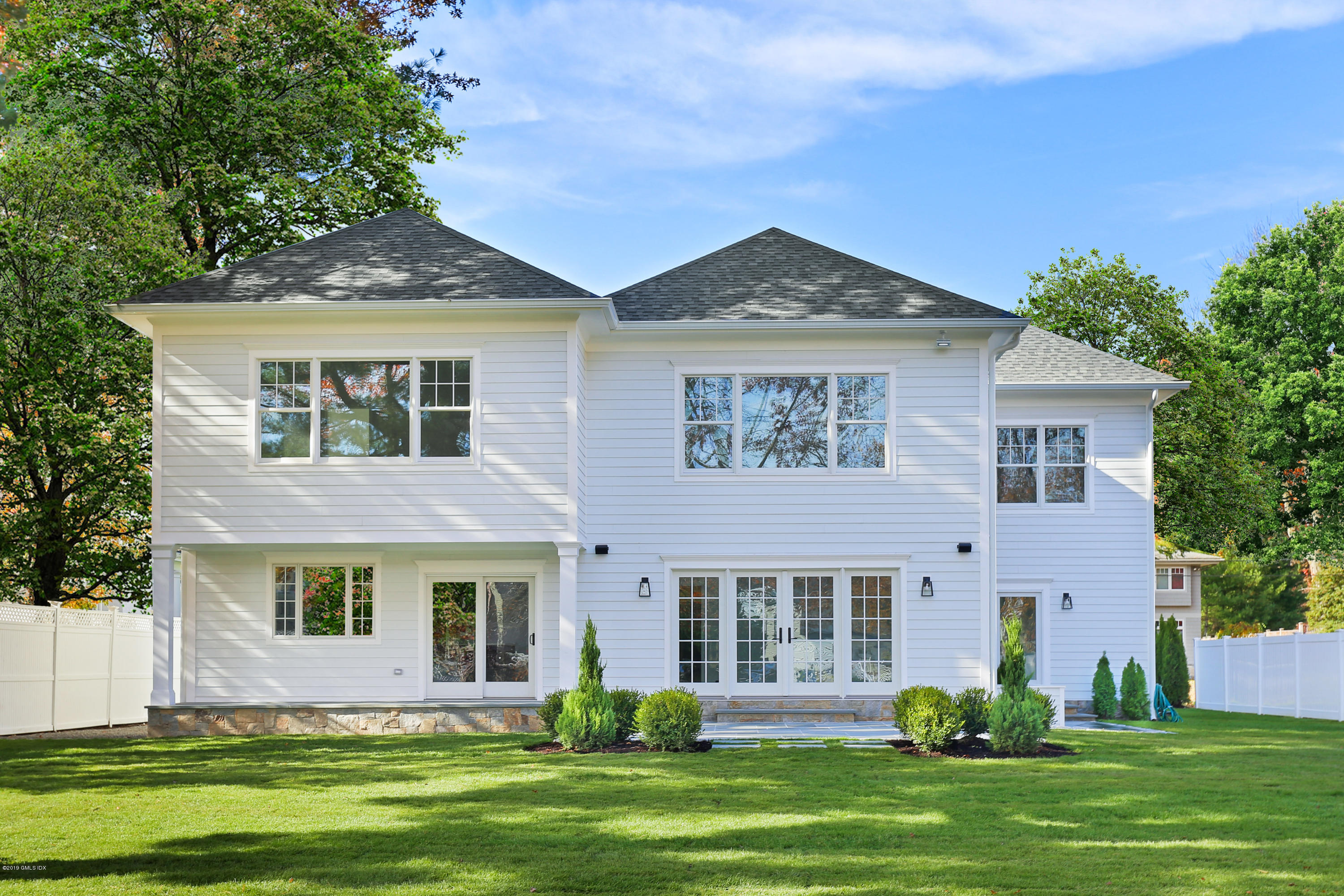 84 Circle Drive Greenwich, CT 06830 - Photo 19 of 25 a front view of a house with a yard