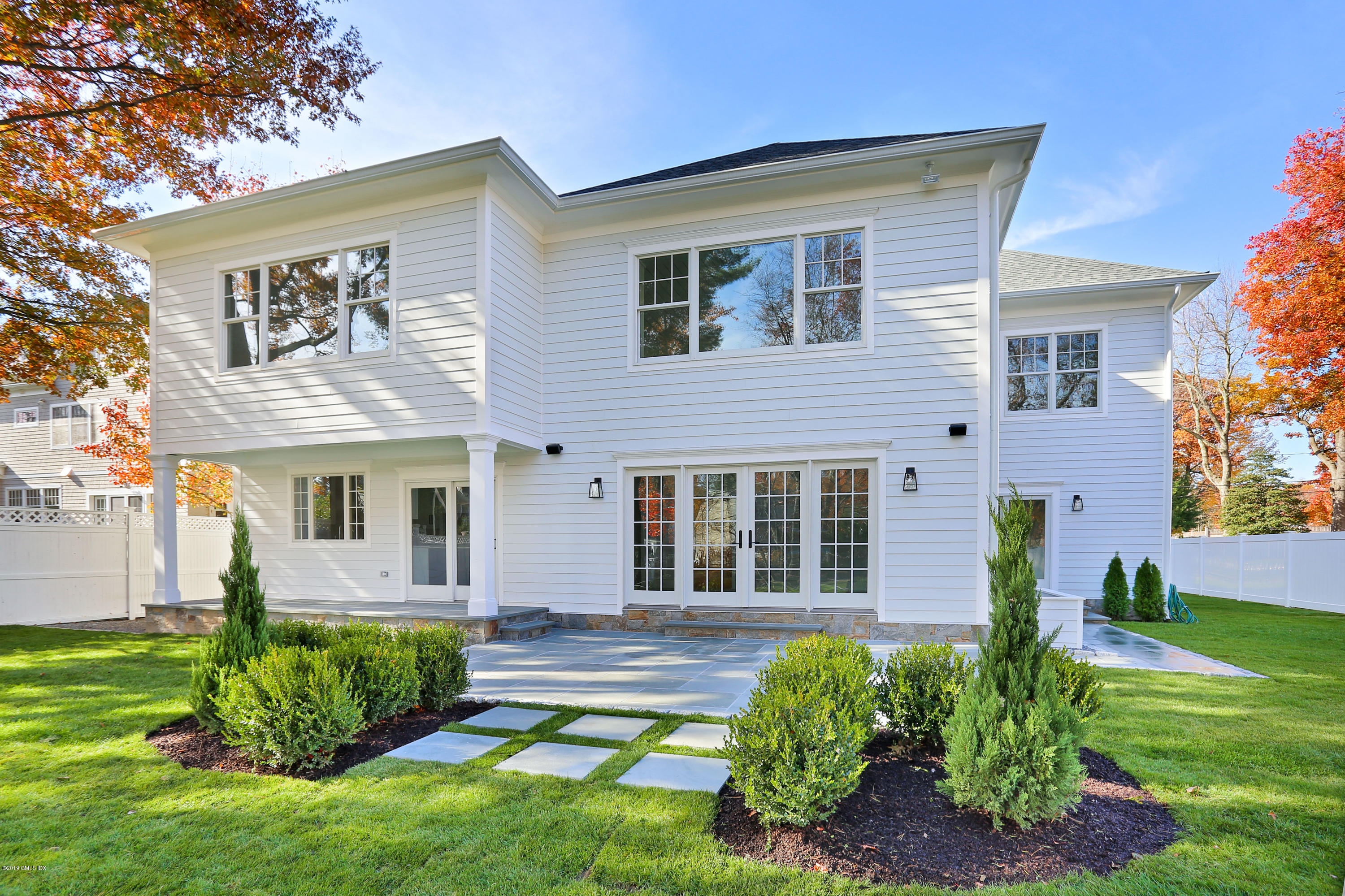 84 Circle Drive Greenwich, CT 06830 - Photo 20 of 25 a front view of a house with garden