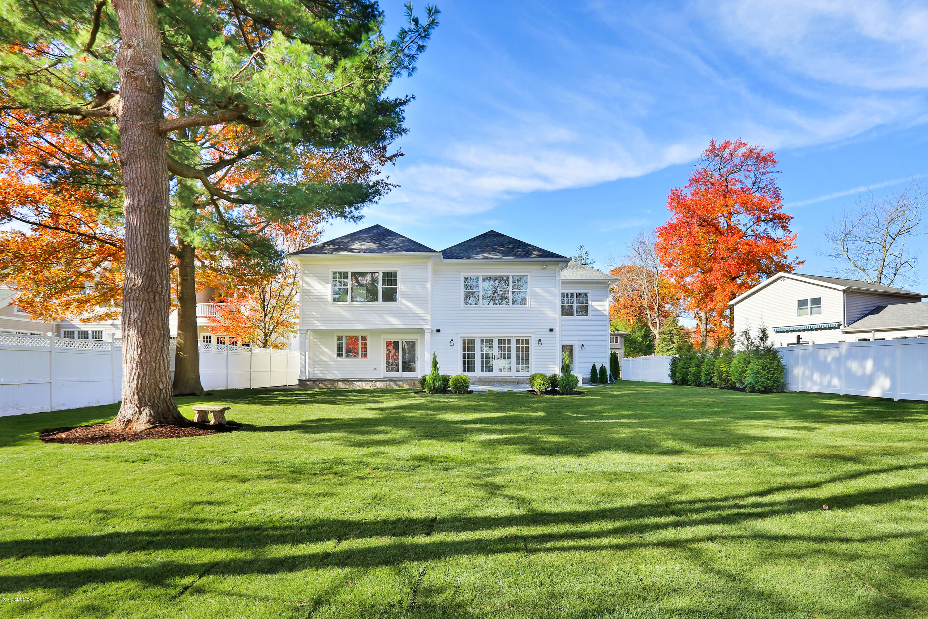 84 Circle Drive Greenwich, CT 06830 - Photo 23 of 25 a front view of a house with a garden