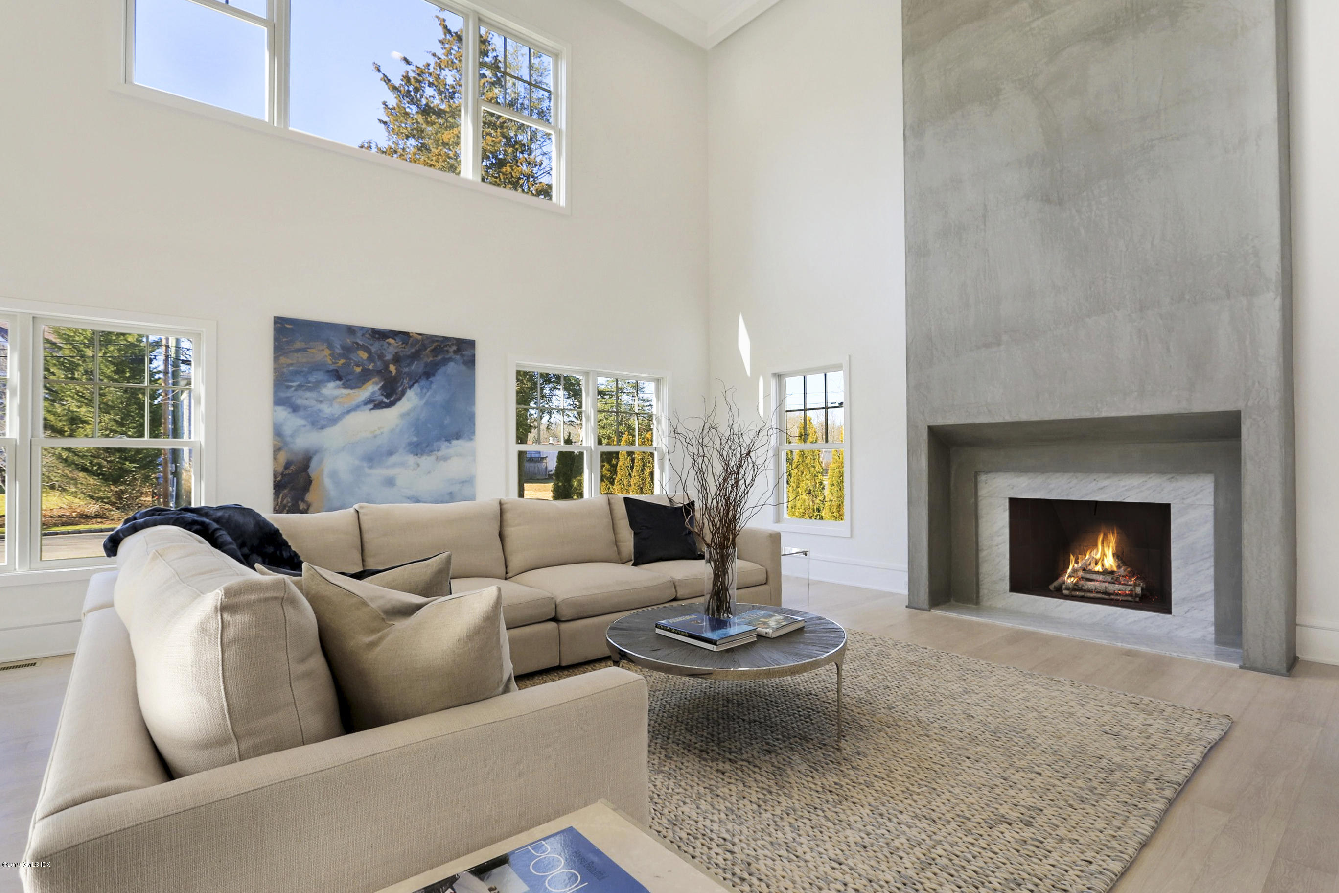 84 Circle Drive Greenwich, CT 06830 - Photo 3 of 25 a living room with furniture and a fireplace
