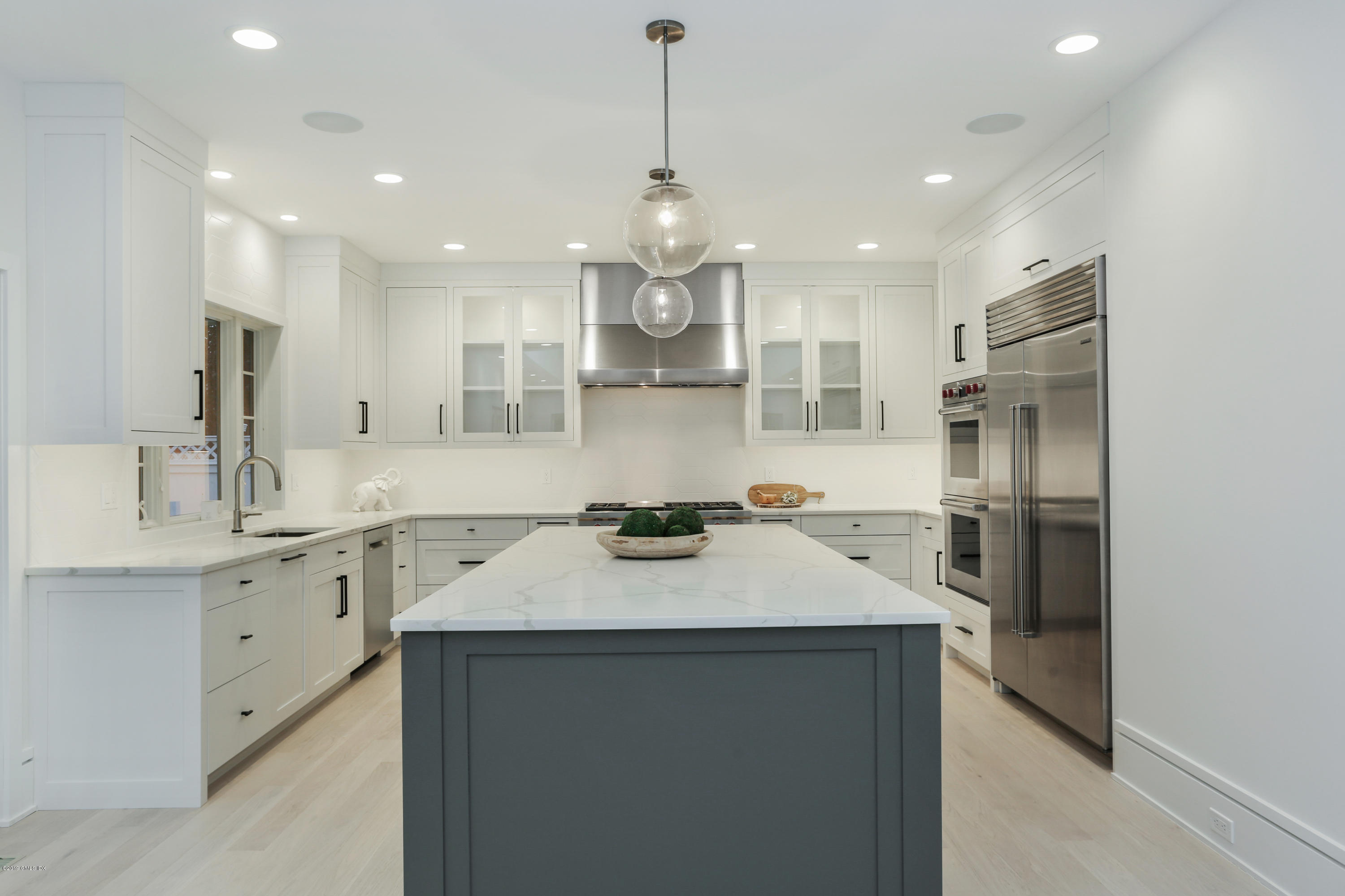 84 Circle Drive Greenwich, CT 06830 - Photo 5 of 25 a kitchen with a sink stainless steel appliances and white cabinets