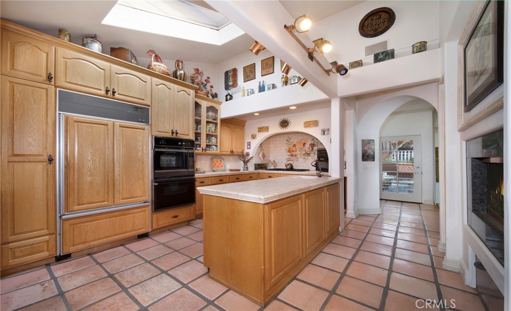 2616 Queda Way Laguna Beach, CA 92651 - Photo 11 of 29 a kitchen with stainless steel appliances granite countertop a stove and a refrigerator