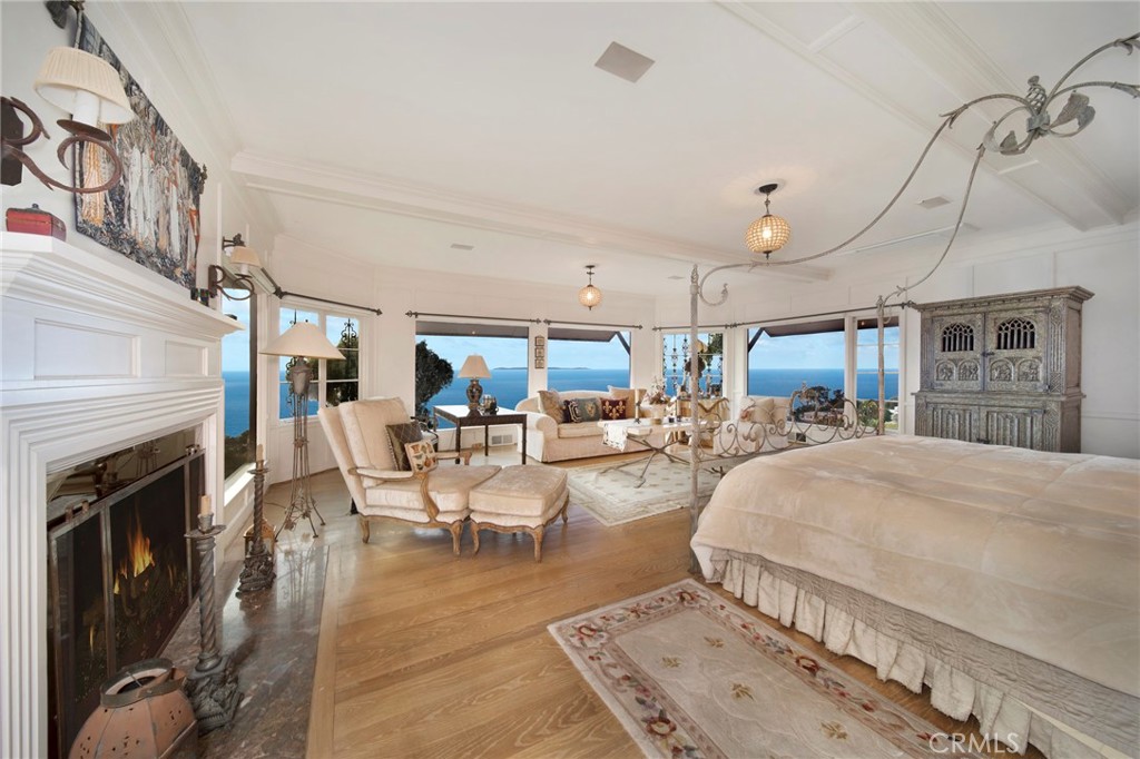 2616 Queda Way Laguna Beach, CA 92651 - Photo 7 of 29 a living room with furniture a fireplace and wooden floor