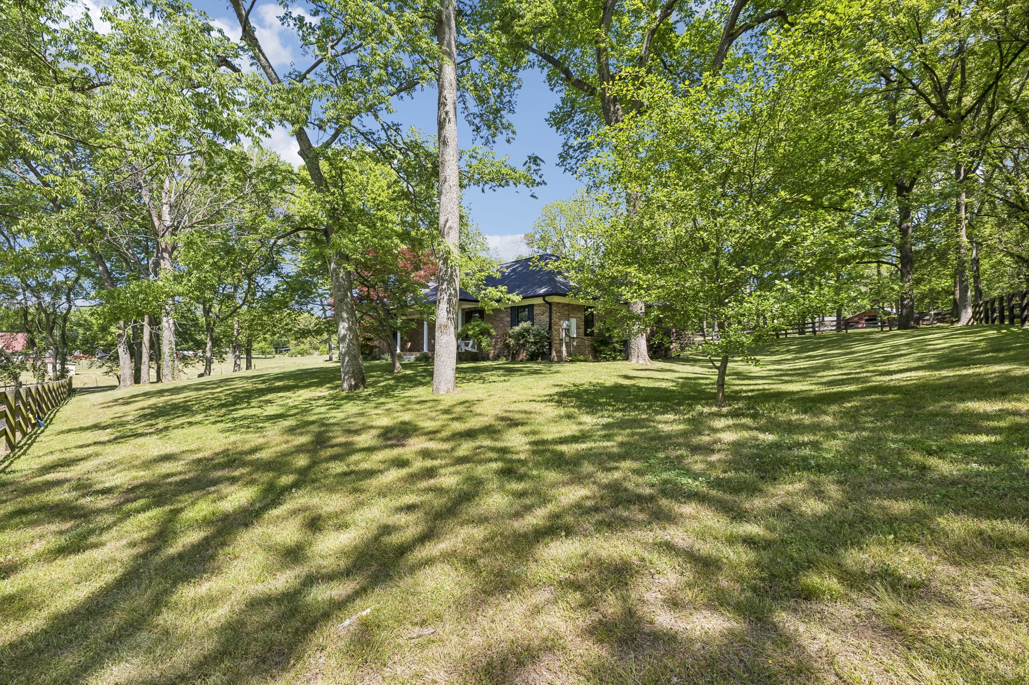 660 Allisona Road Eagleville, TN 37060 - Photo 4 of 87 a backyard of a house with lots of green space and fountain