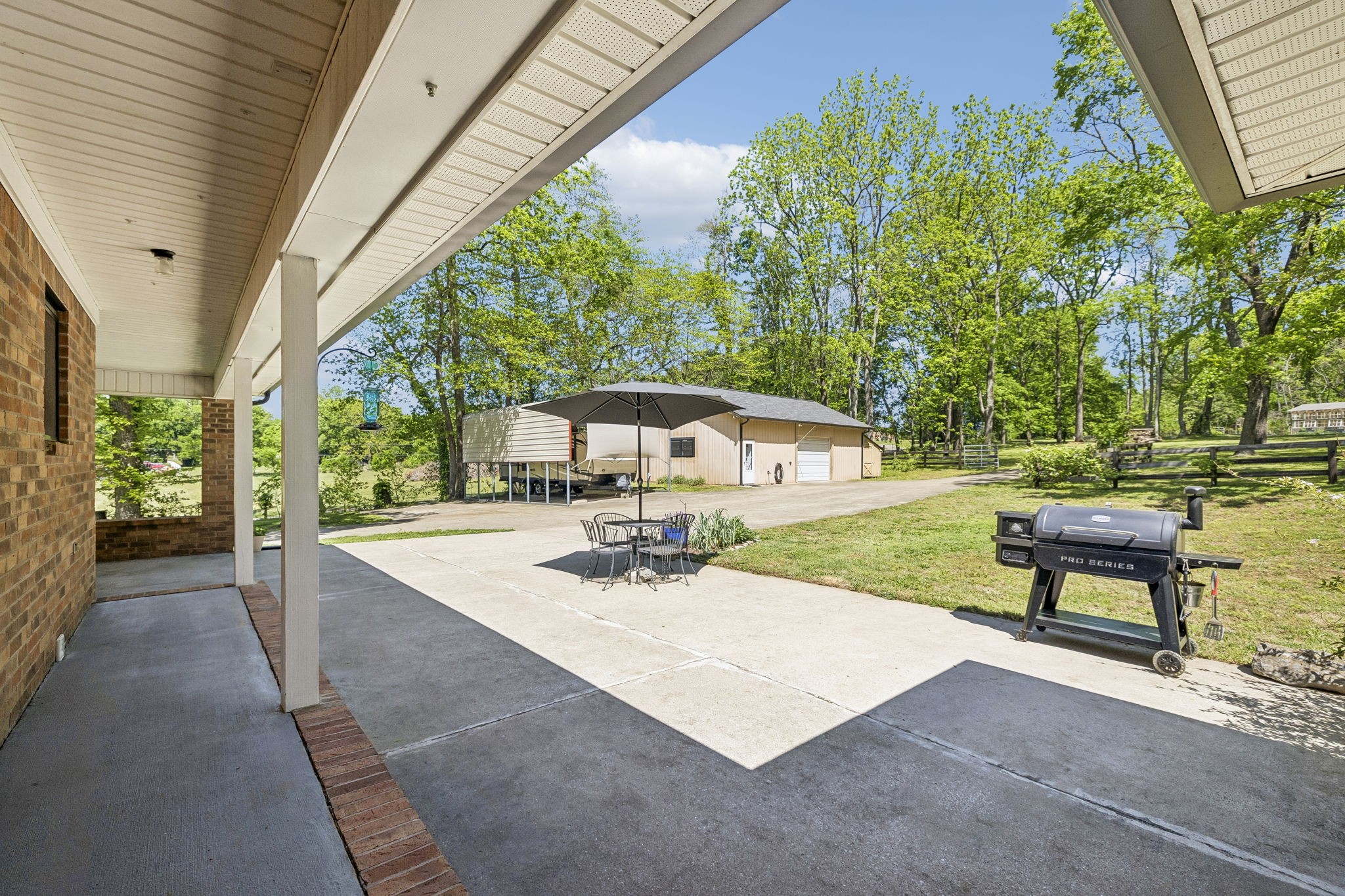 660 Allisona Road Eagleville, TN 37060 - Photo 45 of 87 a view of a patio with table and chairs and potted plants