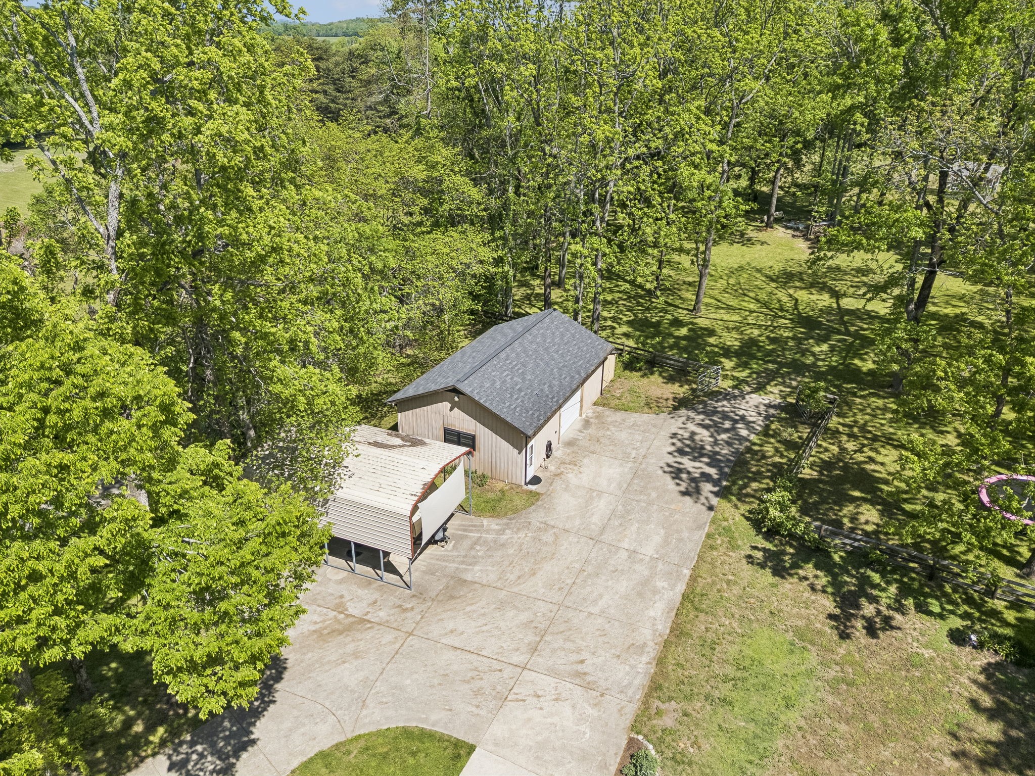 660 Allisona Road Eagleville, TN 37060 - Photo 86 of 87 a view of a yard with plants and a bench