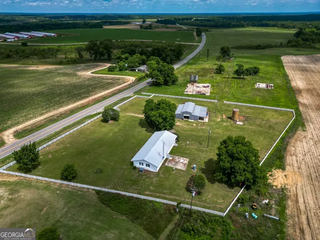 an aerial view of a golf course with chairs