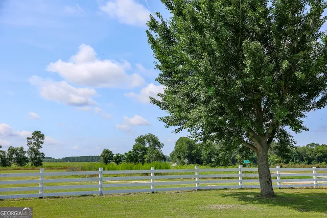 a view of a golf course with a lake
