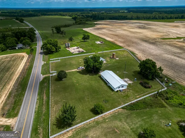 a view of a lake with a yard