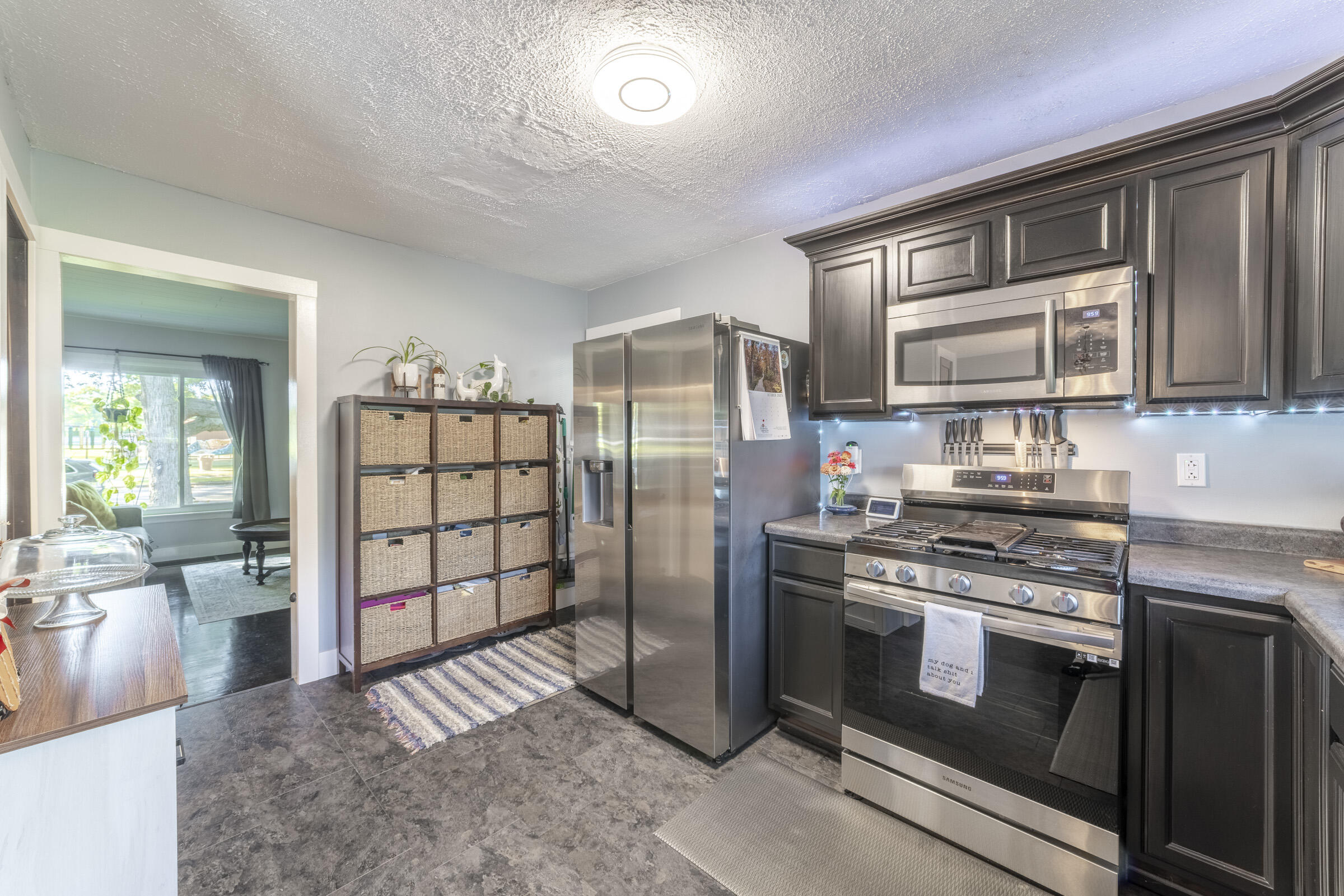 508 West Morgan Avenue Chesterton, IN 46304 - Photo 11 of 38 a kitchen with stainless steel appliances granite countertop a stove a refrigerator and a sink with granite countertops