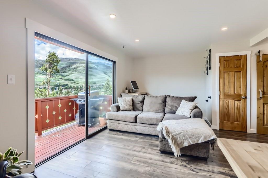 180 Evergreen Road, Unit 204 Dillon, CO 80435 - Photo 2 of 13 a spacious bedroom with a large bed and a couch