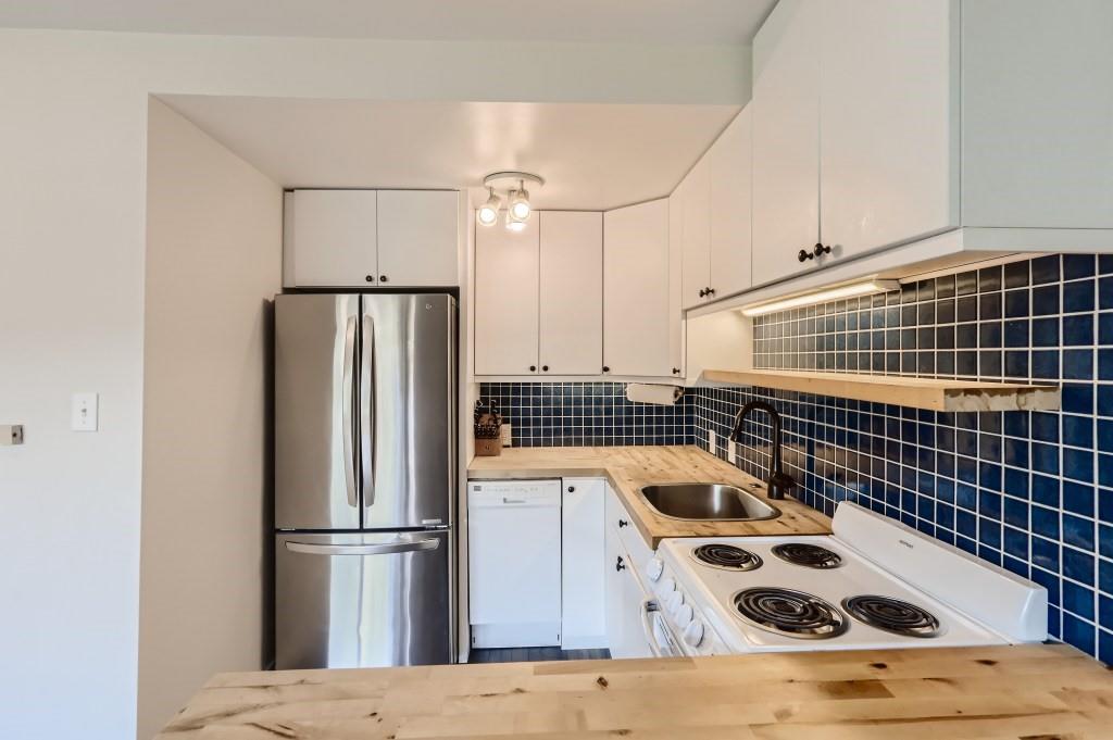 180 Evergreen Road, Unit 204 Dillon, CO 80435 - Photo 6 of 13 a kitchen with a refrigerator and a stove