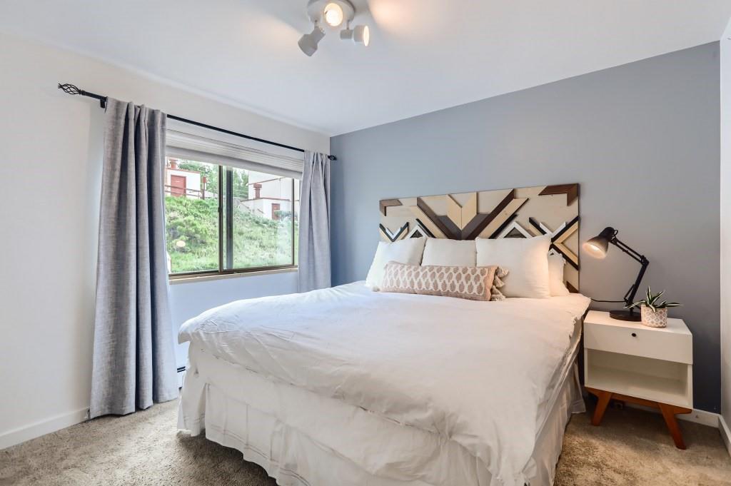 180 Evergreen Road, Unit 204 Dillon, CO 80435 - Photo 8 of 13 a bedroom with a bed and window