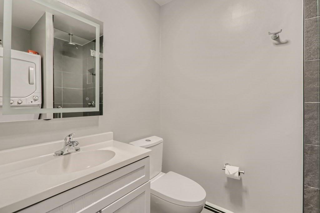 180 Evergreen Road, Unit 204 Dillon, CO 80435 - Photo 10 of 13 a bathroom with a sink a toilet and mirror