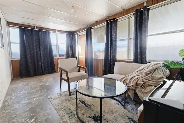 a balcony with table and chairs