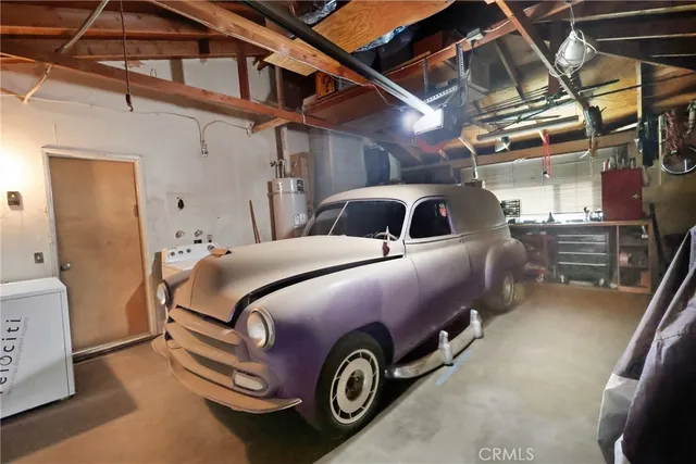 a front view of a house with parking space