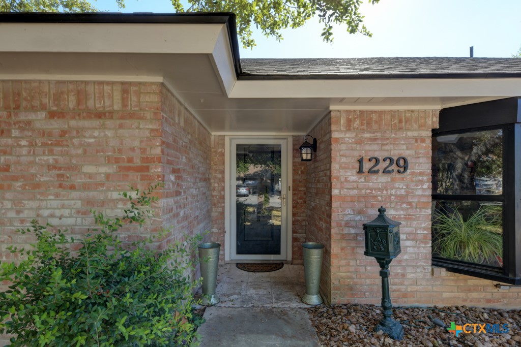1229 Rapids Road New Braunfels, TX 78130 - Photo 3 of 27 a front view of a house with parking space