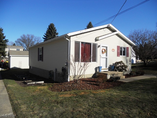 Newer maintenance free vinyl siding and roof. Nicely landscaped yard with many perennials and planter boxes for your garden.