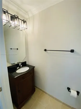 a bathroom with a sink and mirror