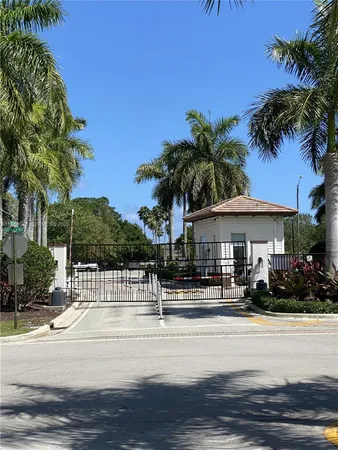 a front view of a house with swimming pool and porch