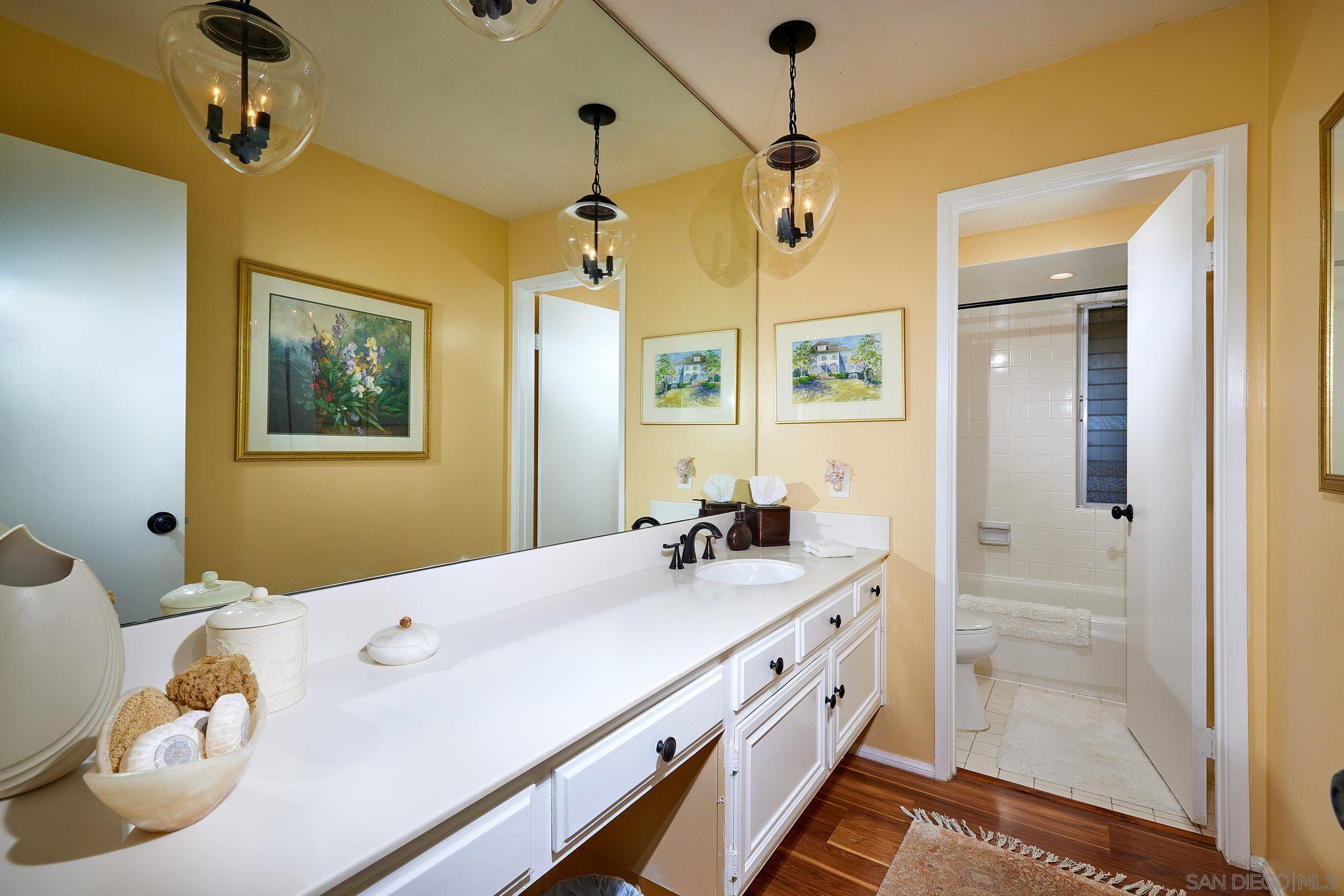 2035 Caminito Circulo Sur La Jolla, CA 92037 - Photo 14 of 22 a kitchen with white cabinets and appliances