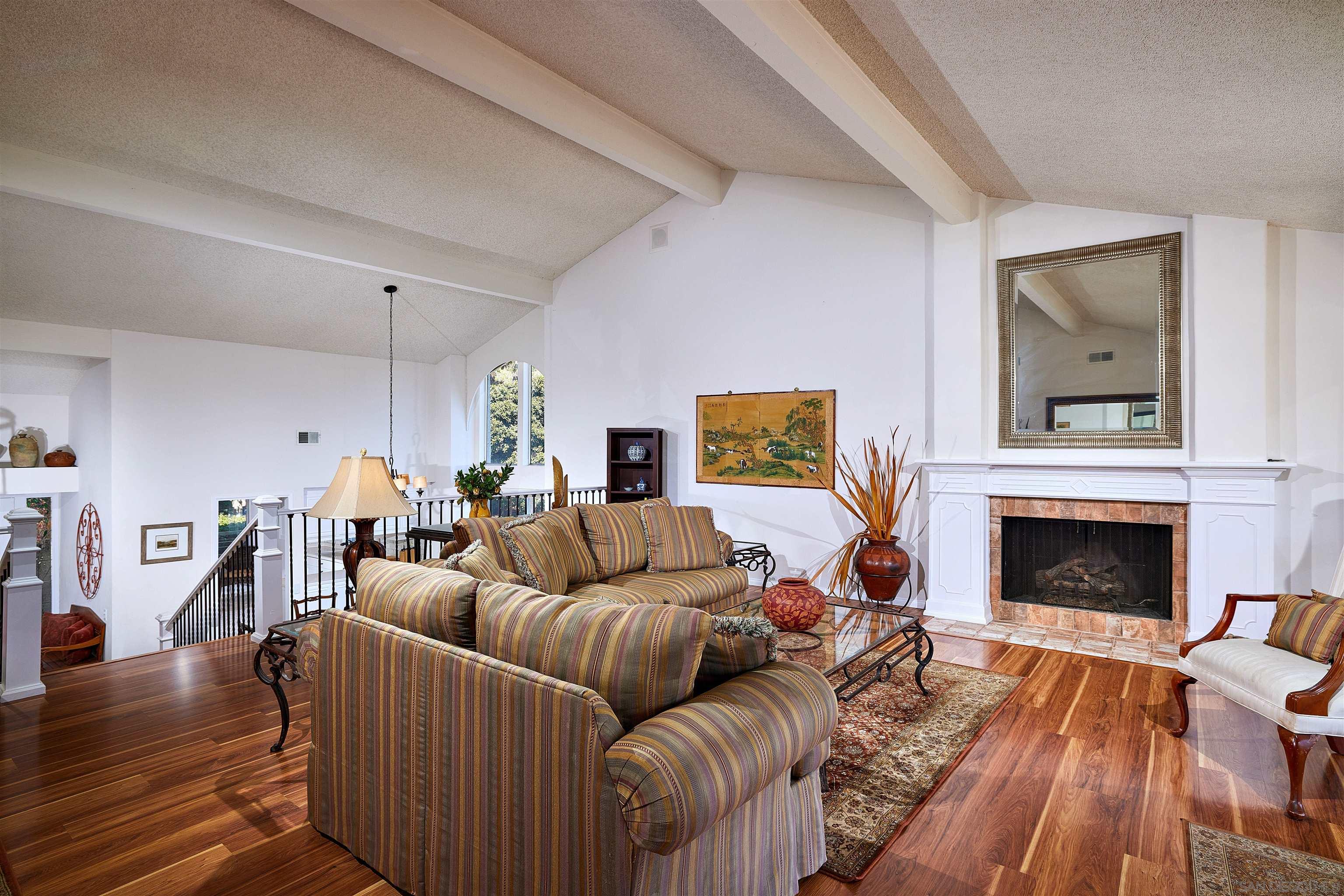 2035 Caminito Circulo Sur La Jolla, CA 92037 - Photo 4 of 22 a living room with furniture and a fireplace