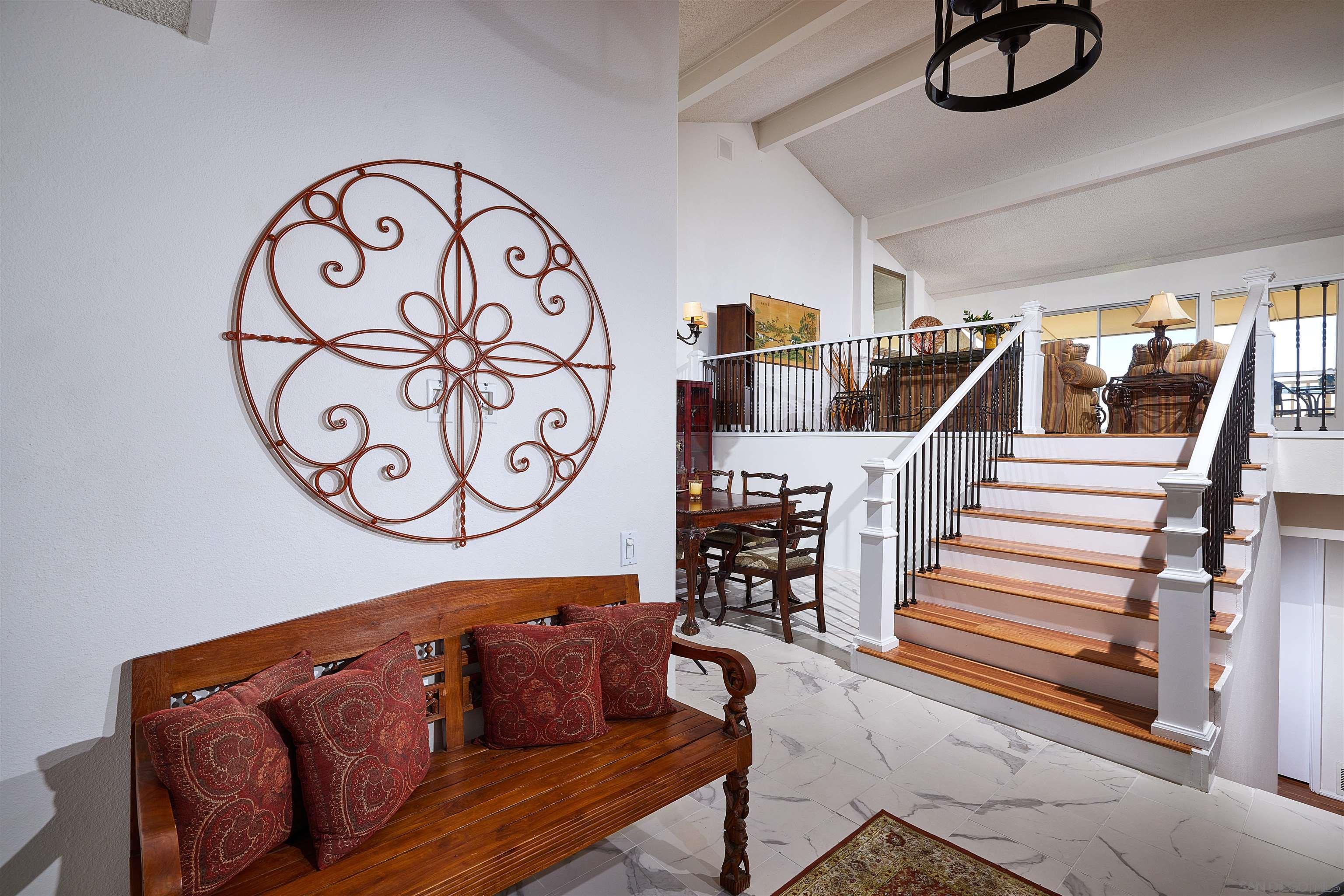 2035 Caminito Circulo Sur La Jolla, CA 92037 - Photo 7 of 22 a bathroom with a granite countertop sink and a mirror