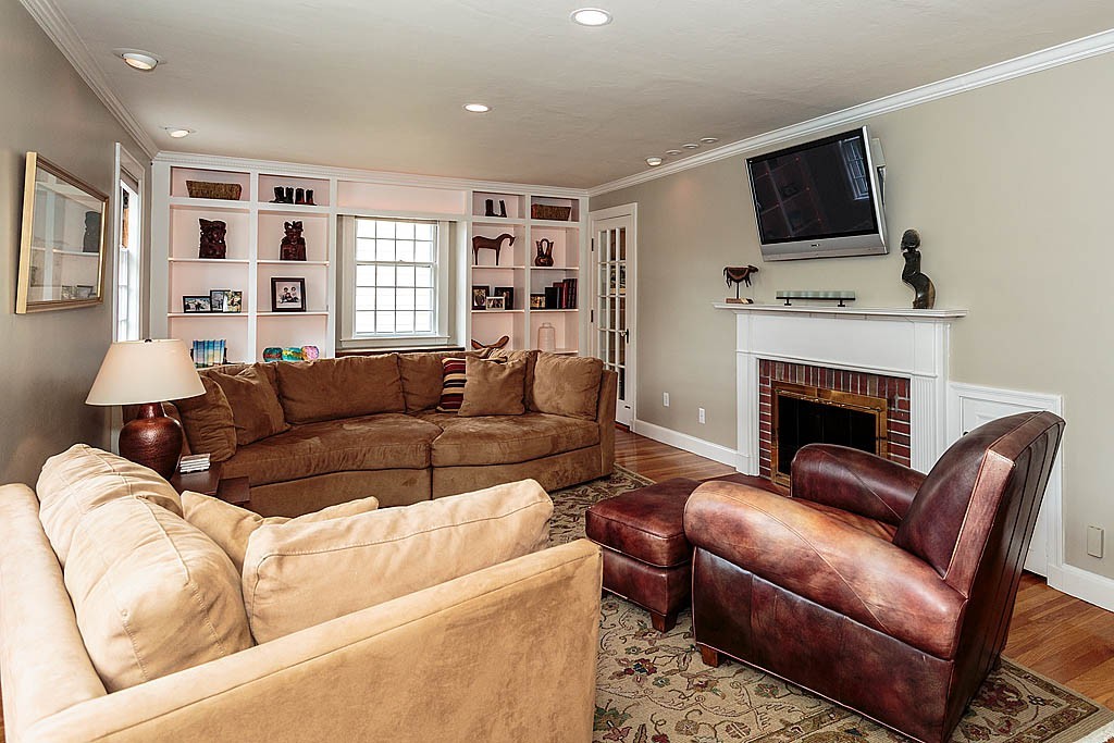 60 Watson Road Belmont, MA 02478 - Photo 3 of 21 a living room with furniture fireplace and flat screen tv