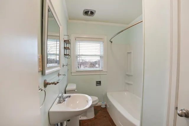 a bathroom with a sink bathtub and a toilet