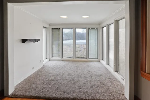 a view of an empty room with a window