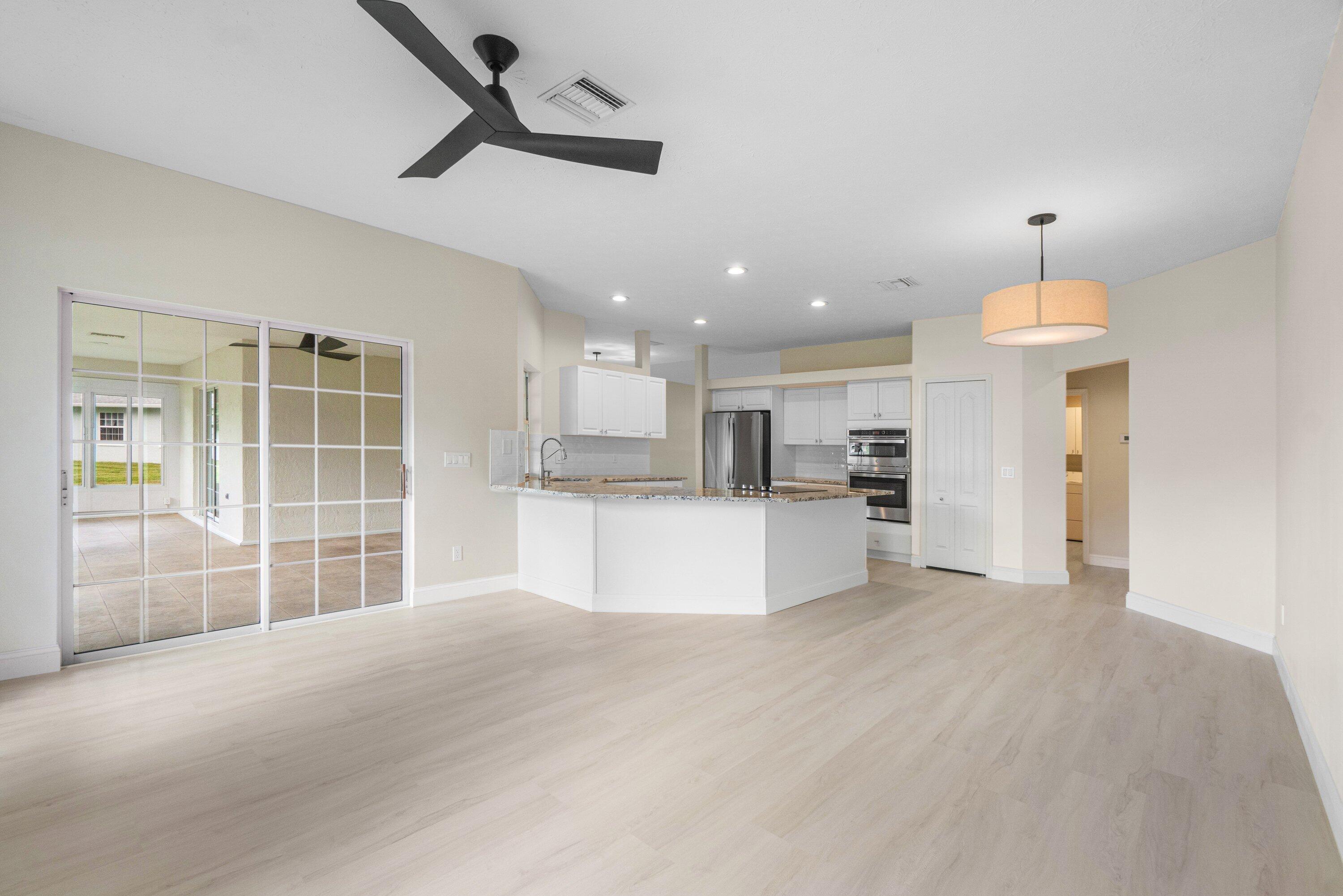 6807 Shelley Terrace Port St. Lucie, FL 34952 - Photo 13 of 34 a view of kitchen with refrigerator and window