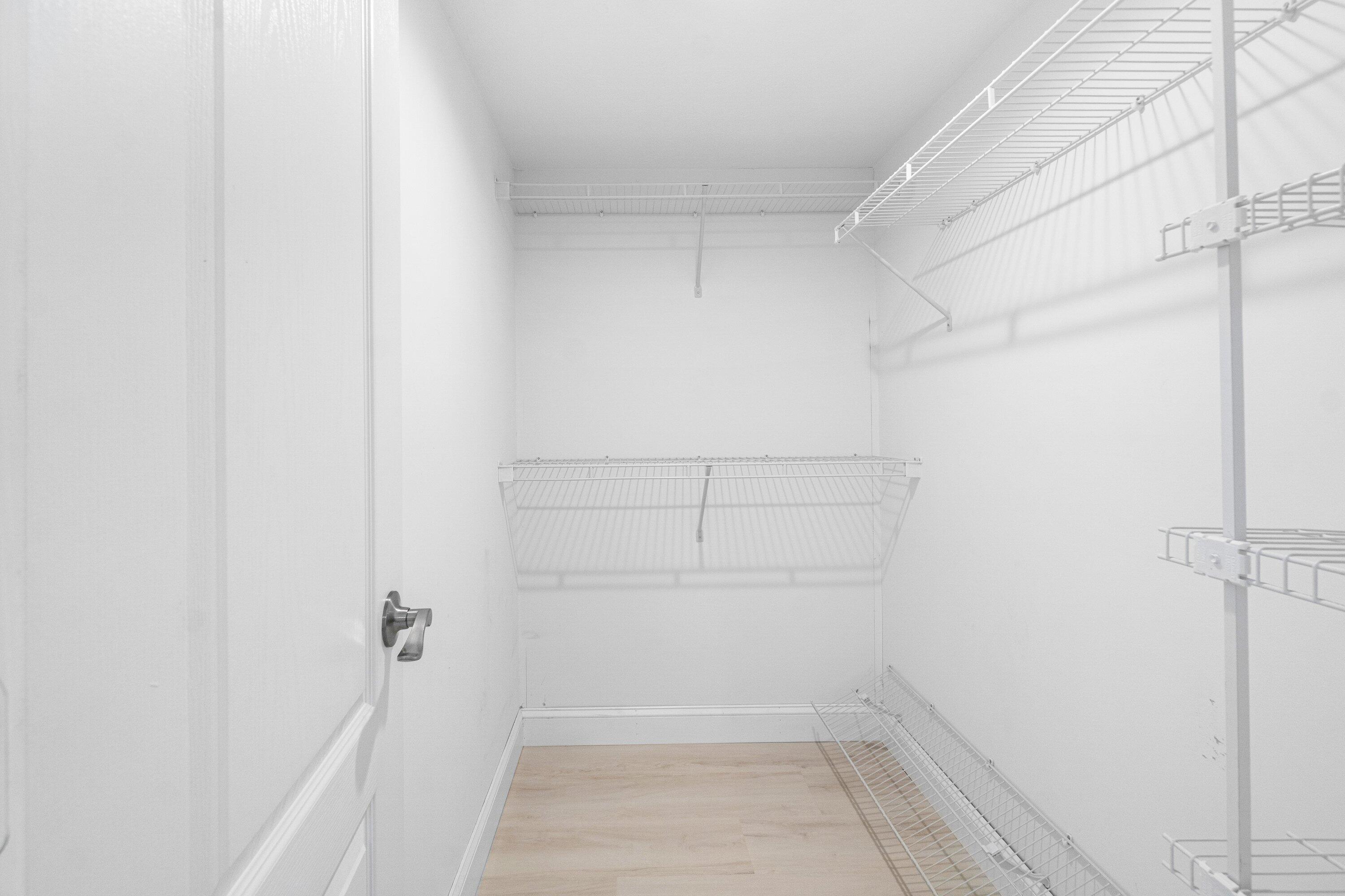 6807 Shelley Terrace Port St. Lucie, FL 34952 - Photo 27 of 34 a view of walk in closet with empty racks